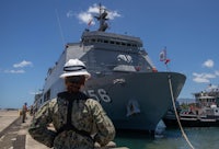 a gray ship in the water