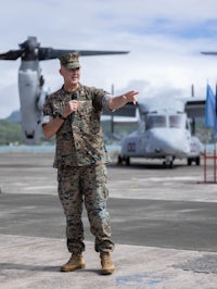 the man is wearing a camouflage uniform