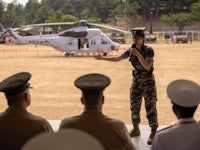 a woman in a military uniform giving a speech