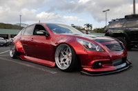a red car parked in a parking lot